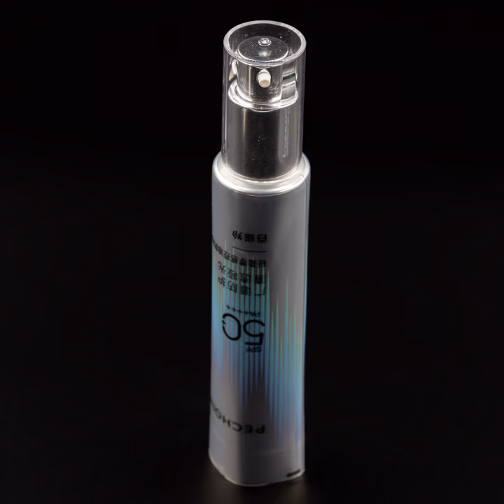 Metallic silver airless pump tube with clear cap