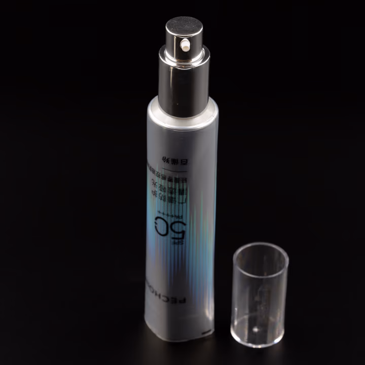 Metallic silver airless pump tube with clear cap, cap off